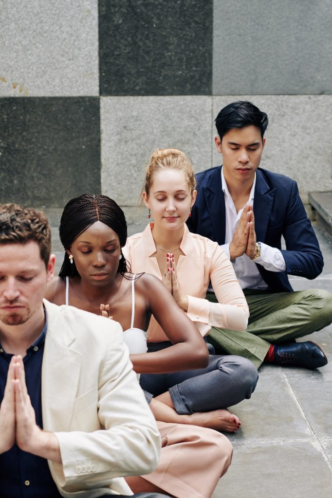 Business people concentrated on meditation
